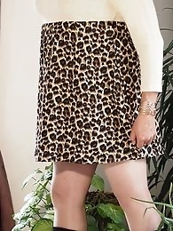 Valisere46 wears a sexy dress in this set of photos.