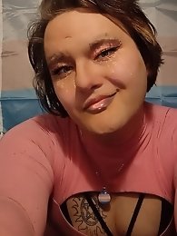 A prostitute removes her provocative dress.