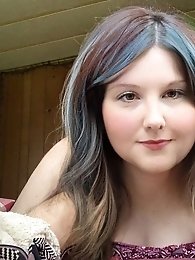 Pretty transsexual woman exposes her breasts.