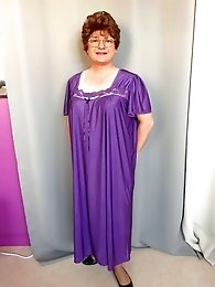 A cross-dressing transvestite in old underclothes.