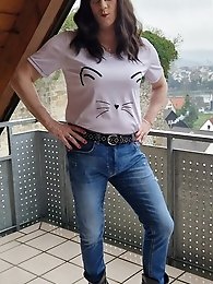 A flexible girl in men s clothes has fun with a cock