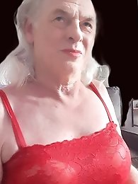 A girl in tart clothes plays with a dildo and simulates sex